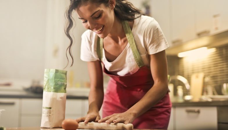 Woman using hemp protein for cake dough